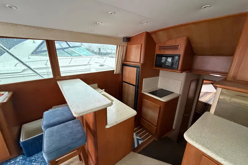 Slide: The Image of Interior of 2001 Egg Harbor 42 SportYacht with kitchen and seating area. - 21