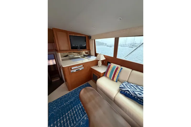 Slide: The Image of Interior of 2001 Egg Harbor 42 SportYacht with cozy seating and nautical decor. - 23