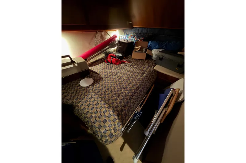 Slide: The Image of Interior cabin of 2001 Egg Harbor 42 SportYacht with bed and storage items. - 27