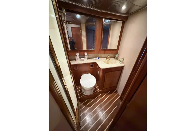 Slide: The Image of Luxurious bathroom in 2001 Egg Harbor 42 SportYacht with wood accents and modern fixtures. - 28