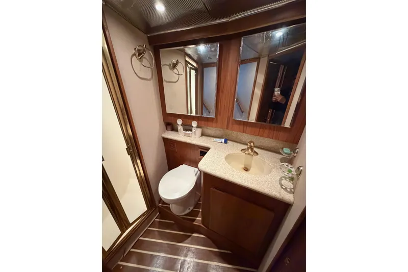 Slide: The Image of Luxurious bathroom in 2001 Egg Harbor 42 SportYacht with wood accents and modern fixtures. - 29