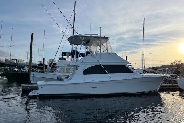 Slide: The Image of 2001 Egg Harbor 42 SportYacht docked at marina during sunset. - 3