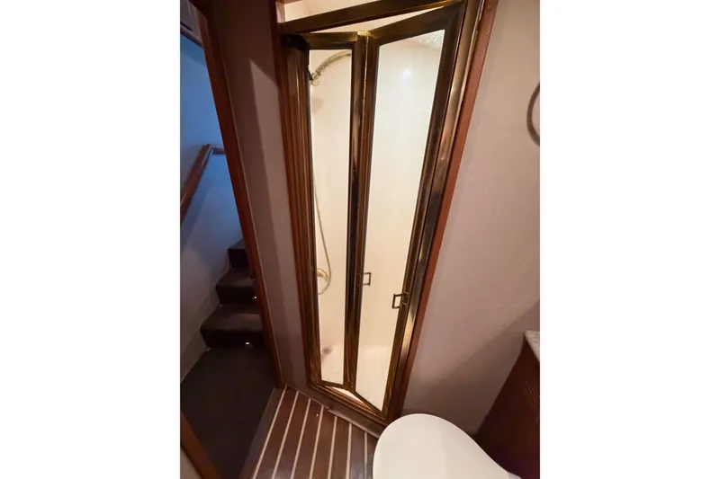 Slide: The Image of Bathroom interior of 2001 Egg Harbor 42 SportYacht with shower and wooden accents. - 30