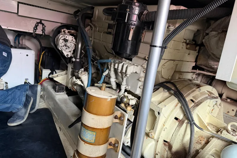 Slide: The Image of Engine room of a 2001 Egg Harbor 42 SportYacht with visible machinery and components. - 34