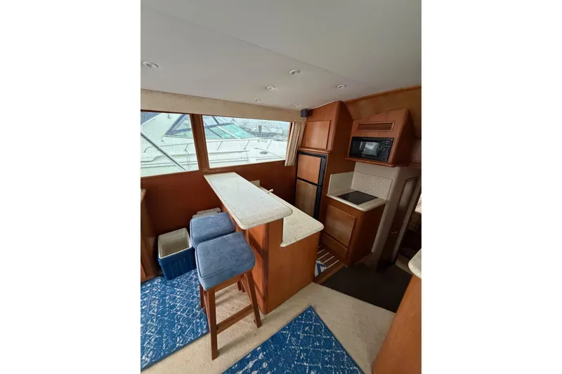 Slide: The Image of Interior of 2001 Egg Harbor 42 SportYacht with kitchen and seating area. - 35