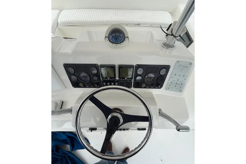 Slide: The Image of Steering console of a 2001 Egg Harbor 42 SportYacht with gauges and controls. - 5