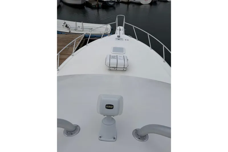 Slide: The Image of Bow view of 2001 Egg Harbor 42 SportYacht docked at marina. - 9