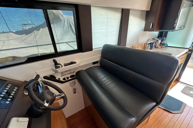 Slide: The Image of Interior of 2018 Tiara Yachts C39 Coupe with helm and seating area. - 20
