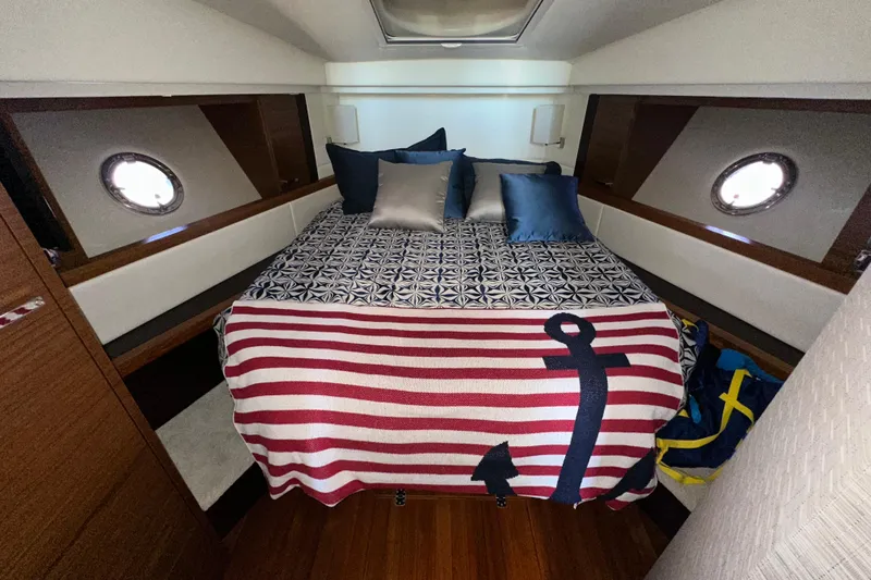Slide: The Image of Cozy bedroom in 2018 Tiara Yachts C39 Coupe with nautical-themed bedding. - 28