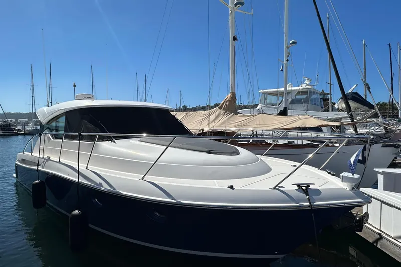 Slide: The Image of 2018 Tiara Yachts C39 Coupe docked at marina under clear blue sky. - 3