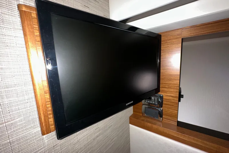 Slide: The Image of Flat-screen TV in 2018 Tiara Yachts C39 Coupe interior, mounted on wooden panel. - 31