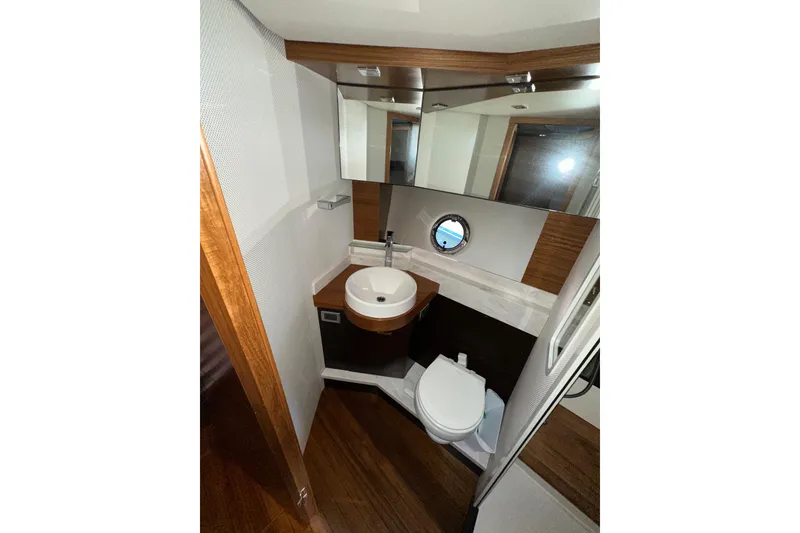 Slide: The Image of Luxurious bathroom in 2018 Tiara Yachts C39 Coupe with modern fixtures and wood accents. - 33