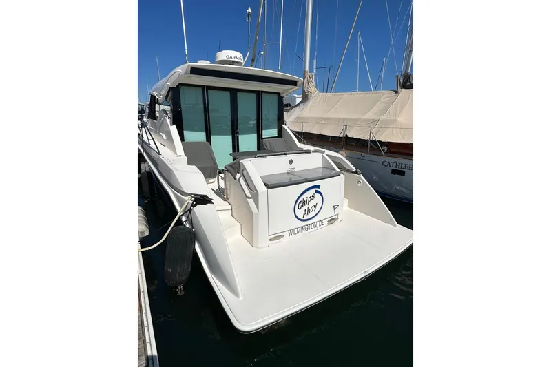 Slide: The Image of 2018 Tiara Yachts C39 Coupe docked, rear view with "Chips Ahoy" nameplate. - 5