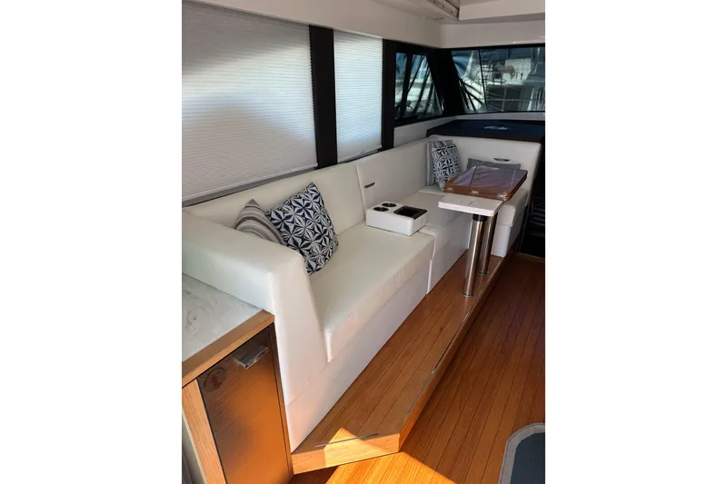 Slide: The Image of Luxurious interior of 2018 Tiara Yachts C39 Coupe with elegant seating and wooden flooring. - 7