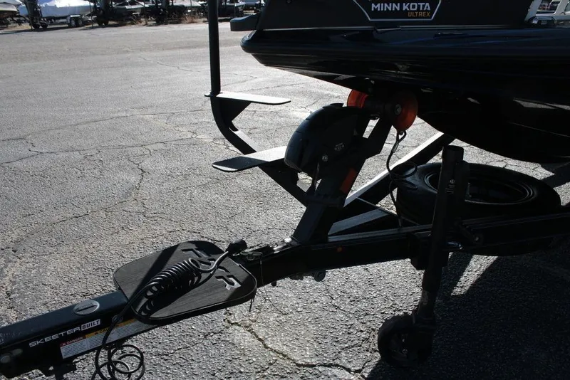 Slide: The Image of 2025 Skeeter FXR21 Limited boat trailer with Minn Kota Ultrex motor. - 1