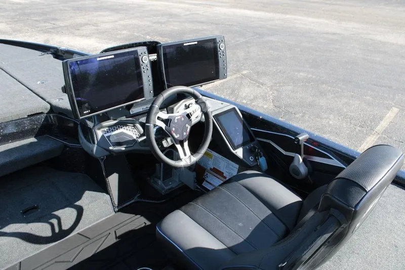 Slide: The Image of 2025 Skeeter FXR21 Limited boat cockpit with advanced navigation displays and steering wheel. - 10