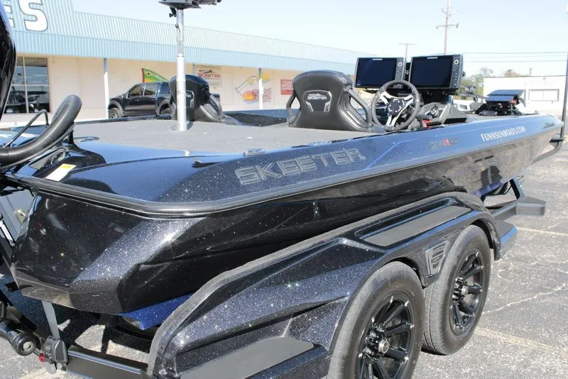 Slide: The Image of 2025 Skeeter FXR21 Limited boat on trailer, featuring sleek design and advanced technology. - 17