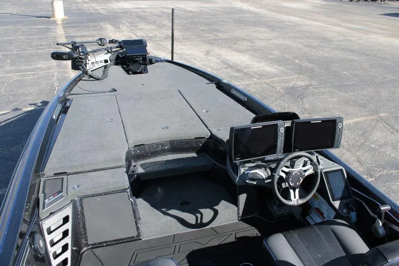 Slide: The Image of 2025 Skeeter FXR21 Limited boat interior with dual screens and advanced controls. - 8