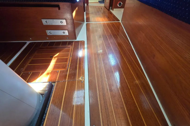 Slide: The Image of Polished wooden interior flooring of a 1988 Pearson 362 Centerboard sailboat. - 25