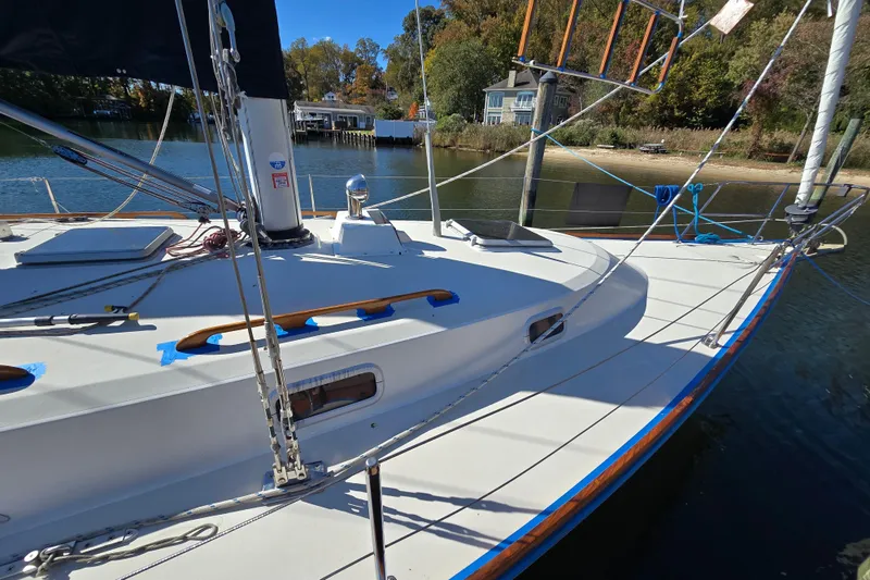 Slide: The Image of 1988 Pearson 362 Centerboard sailboat docked by a scenic waterfront. - 4