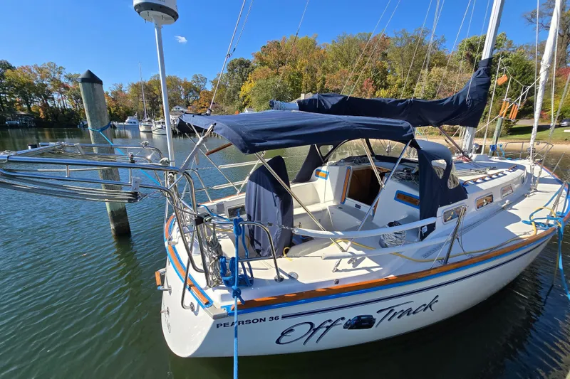 Slide: The Image of 1988 Pearson 362 Centerboard sailboat docked in a scenic marina setting. - 8
