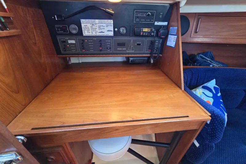 Slide: The Image of Navigation station on 1988 Pearson 362 Centerboard sailboat with wooden desk and control panel. - 9