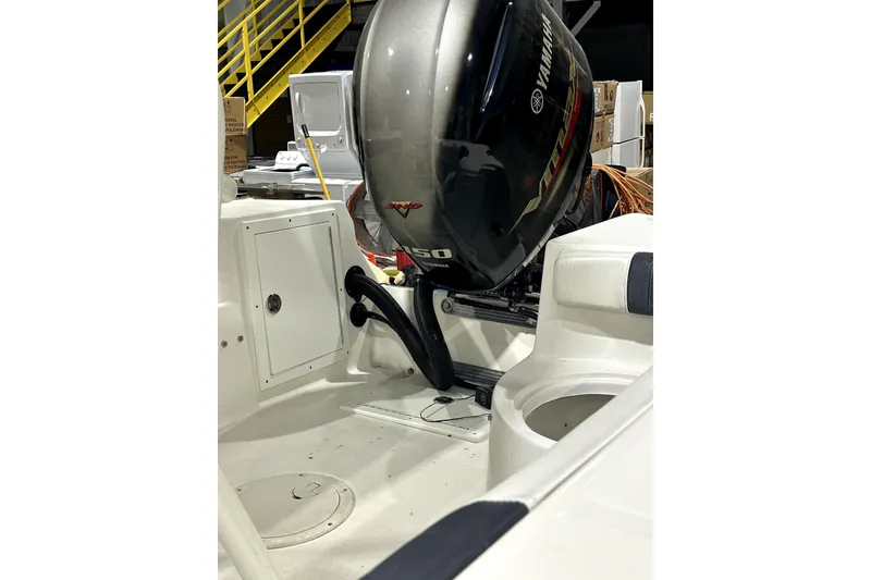 Slide: The Image of 2019 Polar 1 boat interior with Yamaha 150 outboard motor in a warehouse setting. - 5