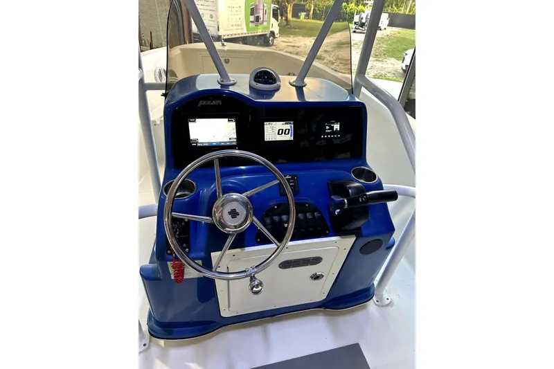 Slide: The Image of Steering console of a 2019 Polar 1 boat with navigation displays and controls. - 8