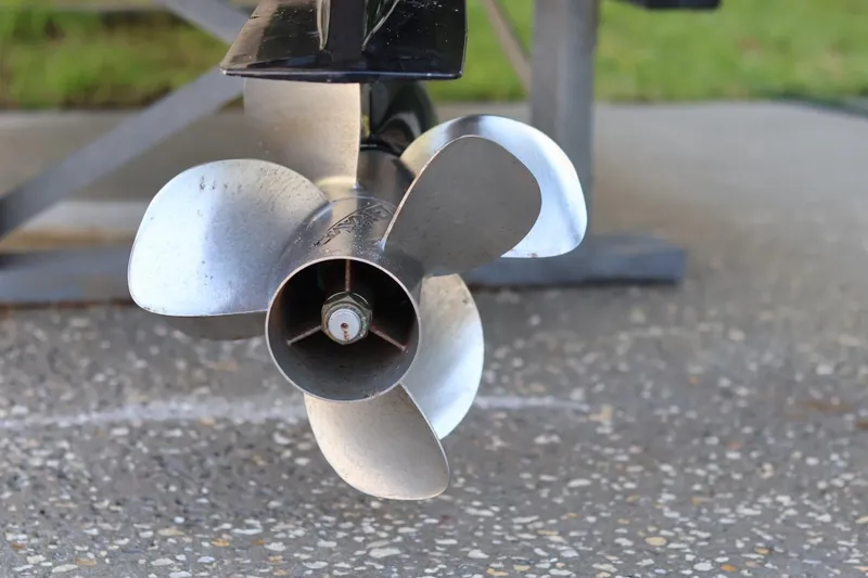 Slide: The Image of Close-up of a 2010 Monterey 254FS boat propeller on a textured surface. - 13