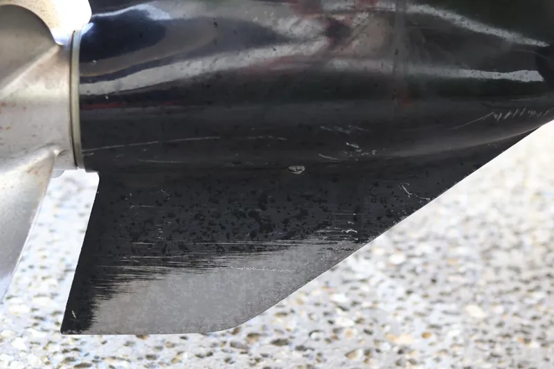 Slide: The Image of Close-up of a scratched propeller blade on a 2010 Monterey 254FS boat. - 14