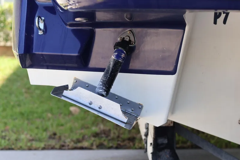 Slide: The Image of 2010 Monterey 254FS boat stern with trim tab and hydraulic actuator. - 15