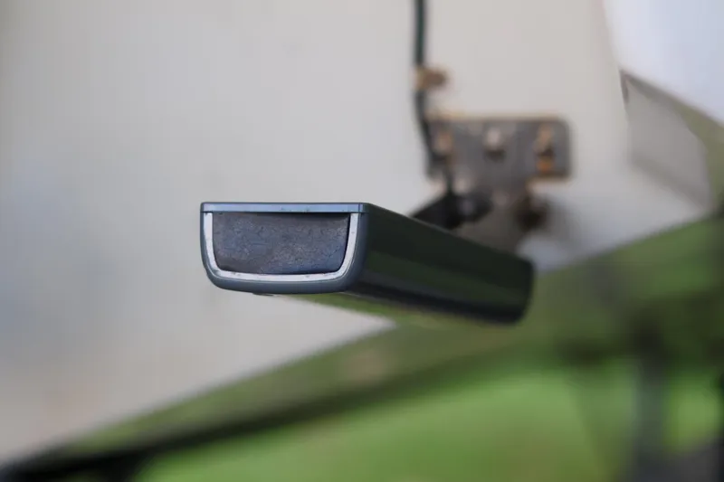 Slide: The Image of Close-up of a 2010 Monterey 254FS boat component, mounted on a metal bracket. - 17