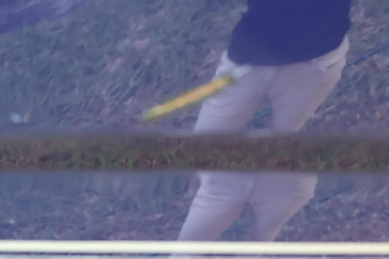 Slide: The Image of Reflection on 2010 Monterey 254FS boat surface with person cleaning. - 18