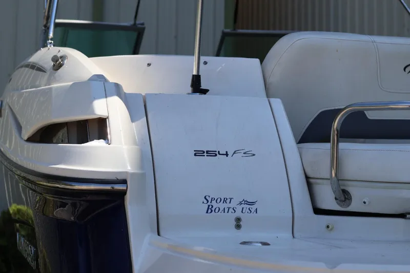 Slide: The Image of 2010 Monterey 254FS boat, white exterior, Sport Boats USA branding. - 21