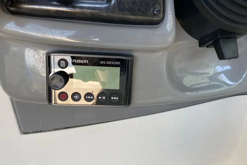 Slide: The Image of Fusion MS-NRX300 stereo control on 2010 Monterey 254FS boat dashboard. - 29