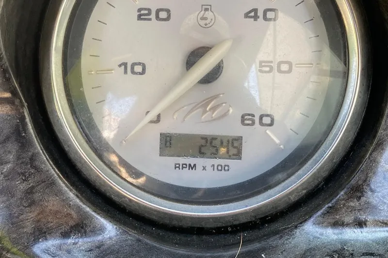 Slide: The Image of Close-up of 2010 Monterey 254FS tachometer displaying 2545 RPM. - 30