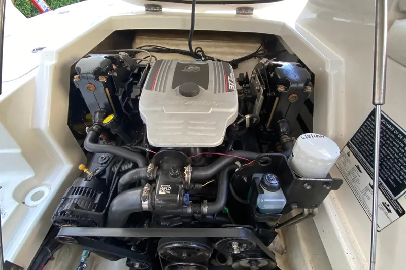 Slide: The Image of 2010 Monterey 254FS boat engine compartment with visible components and labels. - 38