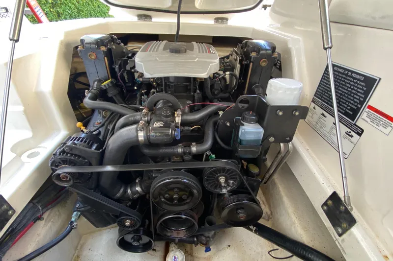 Slide: The Image of Engine compartment of a 2010 Monterey 254FS boat, showcasing detailed mechanical components. - 39