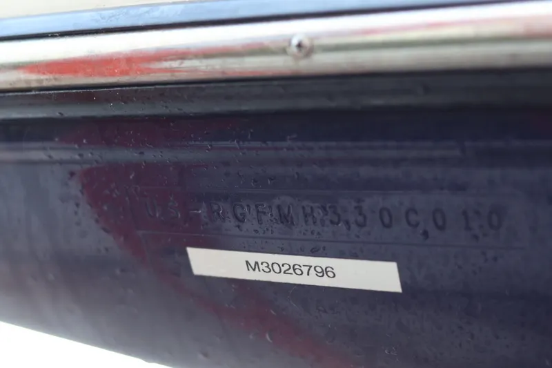 Slide: The Image of Close-up of a 2010 Monterey 254FS boat hull identification number. - 42