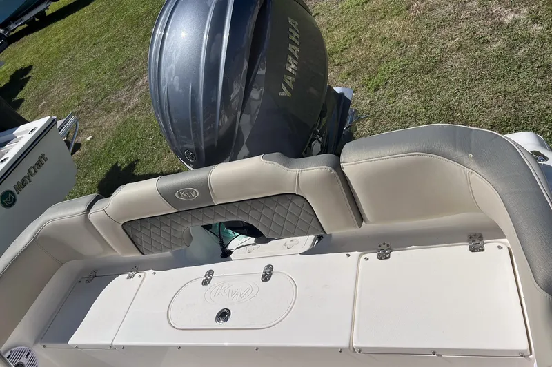 Slide: The Image of 2026 Key West 203 FS boat interior with steering wheel and control panel. - 10