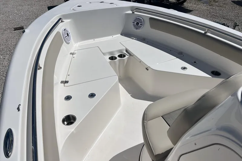Slide: The Image of 2026 Key West 203 FS boat interior with seating and cup holders. - 12