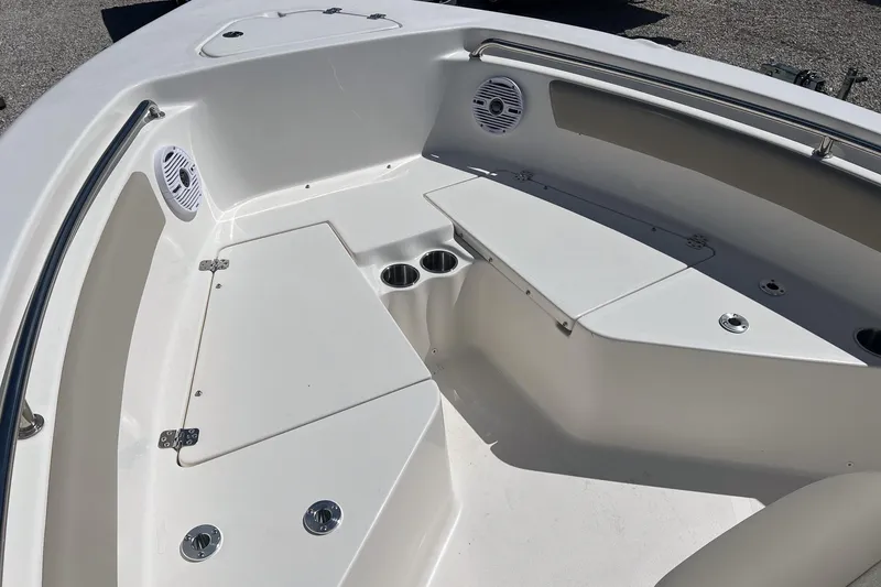 Slide: The Image of 2026 Key West 203 FS boat interior with cushioned seating and sleek design. - 13