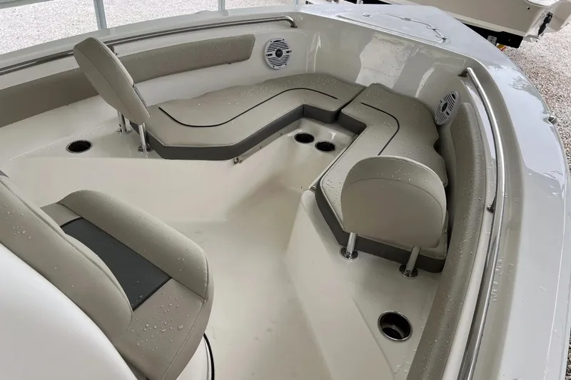 Slide: The Image of 2026 Key West 203 FS boat interior with cushioned seating and speaker system. - 18