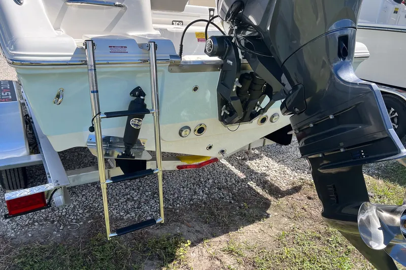 Slide: The Image of Key West 203 FS 2026 boat with motor and ladder on trailer. - 4