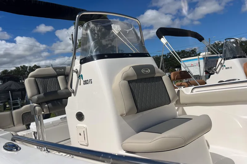 Slide: The Image of 2026 Key West 203 FS boat dashboard with steering wheel and controls. - 6