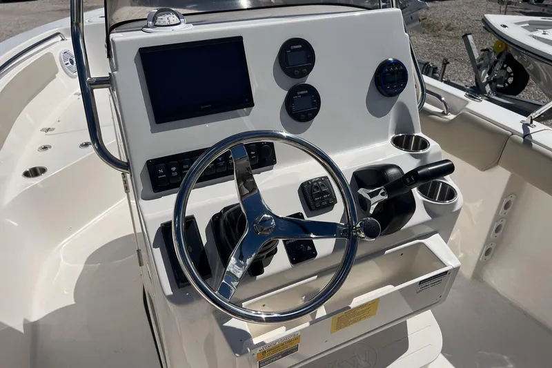 Slide: The Image of Steering console of 2026 Key West 203 FS boat with modern controls and gauges. - 7
