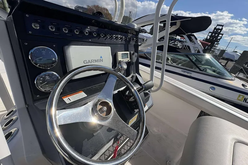 Slide: The Image of Steering console of 2016 Wellcraft 242 Fisherman boat with Garmin navigation system. - 12