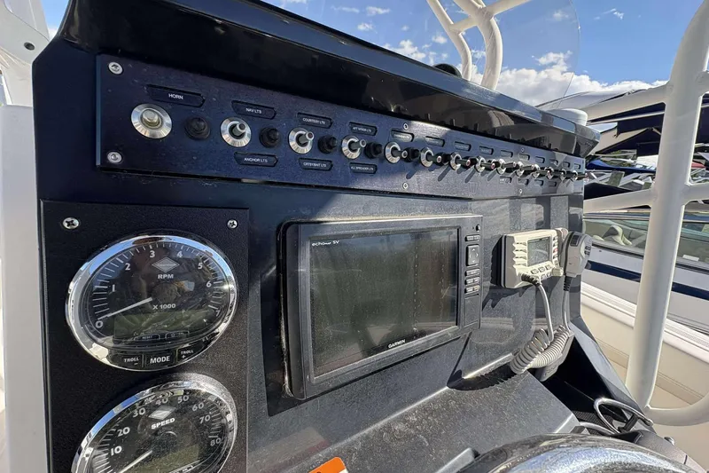 Slide: The Image of Control panel of 2016 Wellcraft 242 Fisherman boat with gauges and electronics. - 13