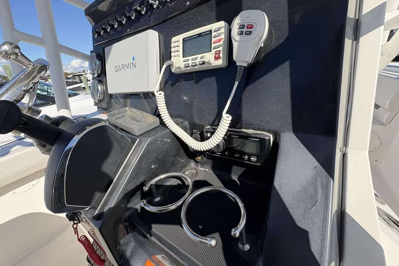 Slide: The Image of Control panel of 2016 Wellcraft 242 Fisherman boat with Garmin navigation system. - 14