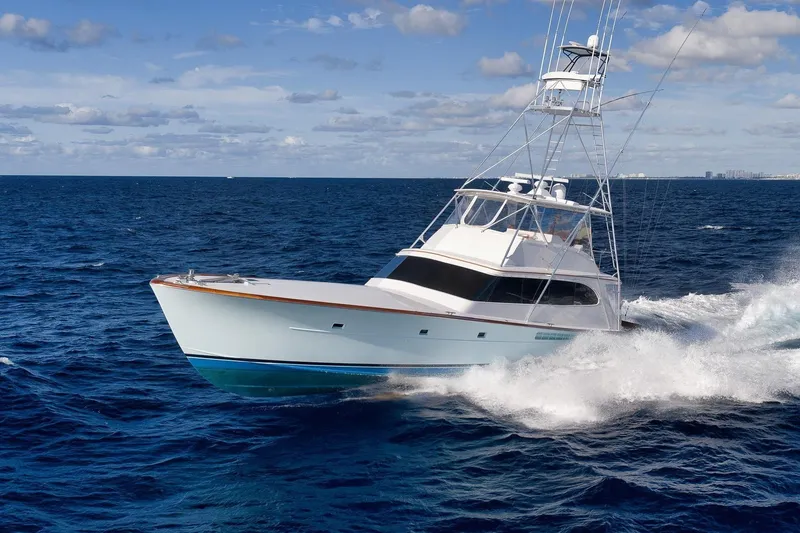 The Image of 1993 Merritt Sportfish yacht cruising on open ocean under clear skies. - 0